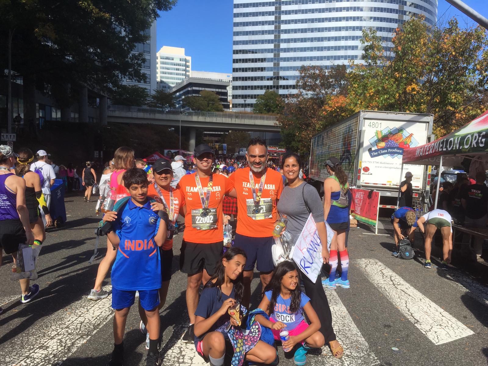 Couple with medals by water