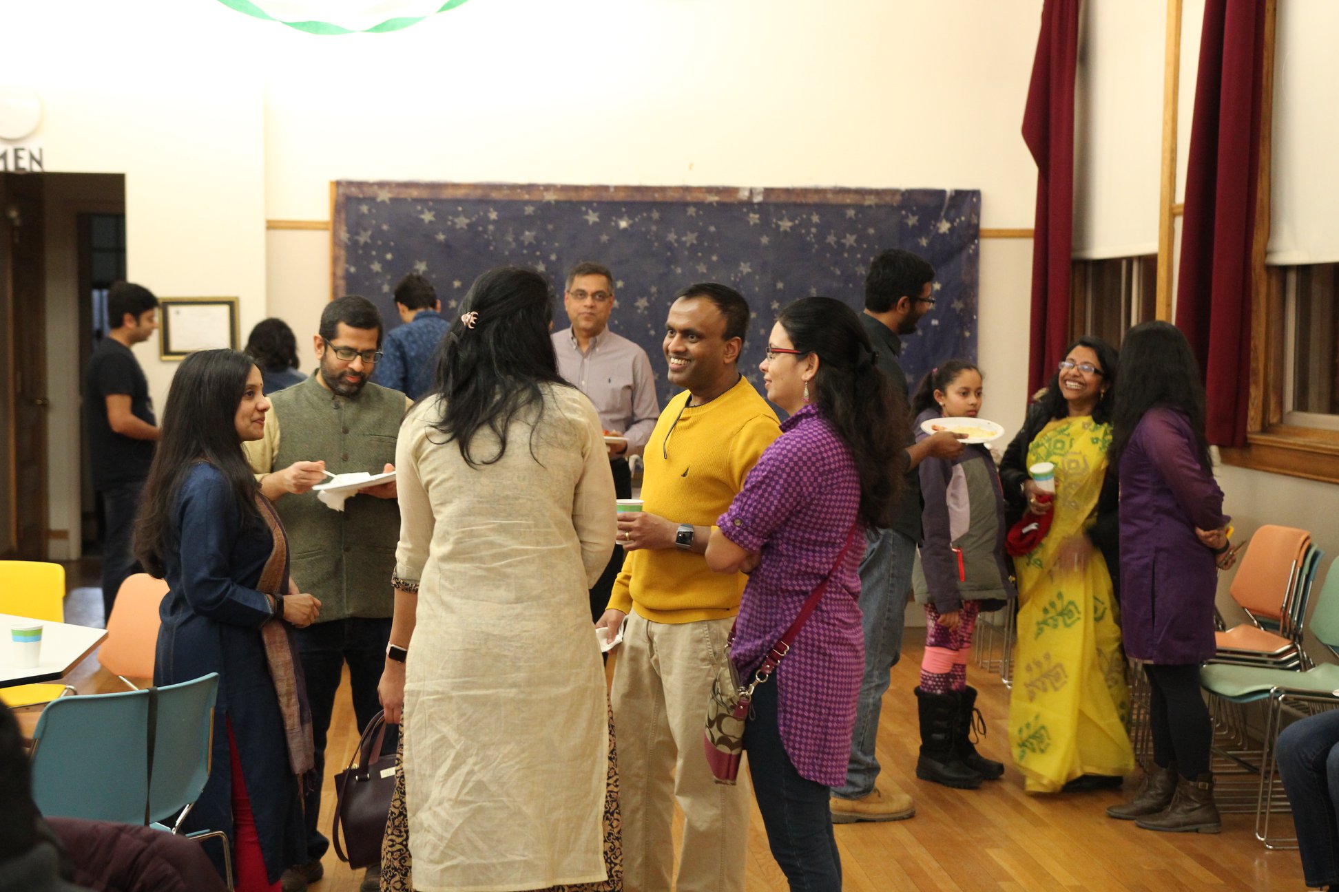Family with Go Team AidAsha sign