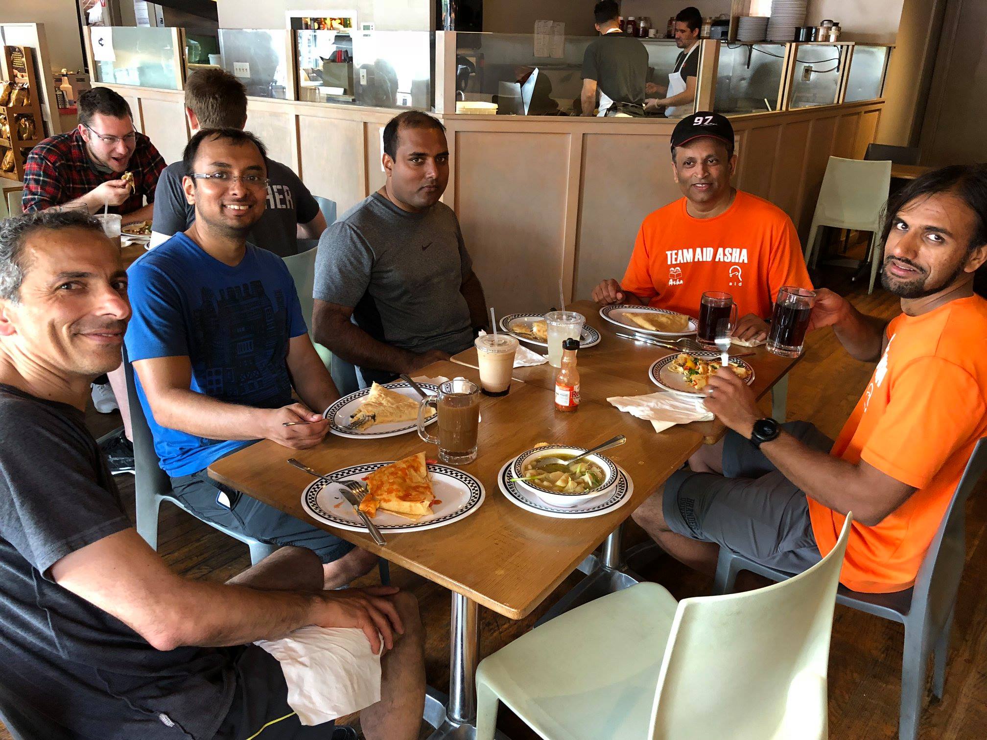 TeamAIDAsha hydration and gear setup at park